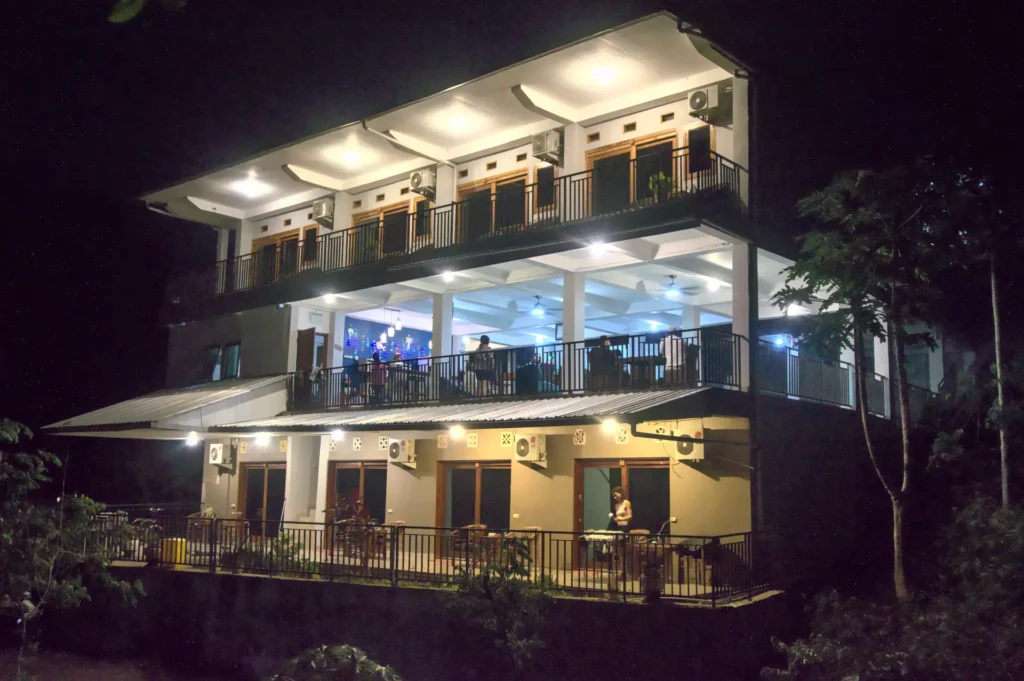 Hotel Bonne Nuit night facade with warm lighting