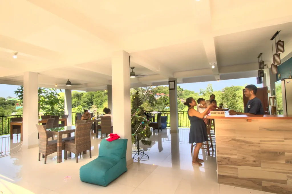 Reception desk and welcoming staff at Hotel Bonne Nuit